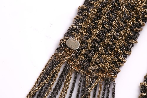 Lot 201 - A bi-coloured metal mesh lariat scarf,...