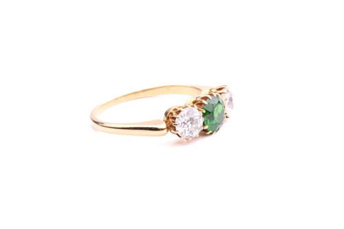 Lot 26 - A tsavorite and diamond three-stone ring,...