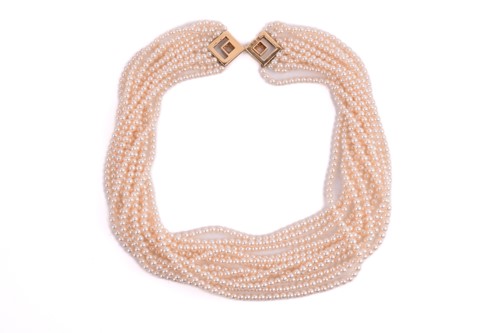 Lot 133 - A twelve-strand pearl torsade necklace with a...