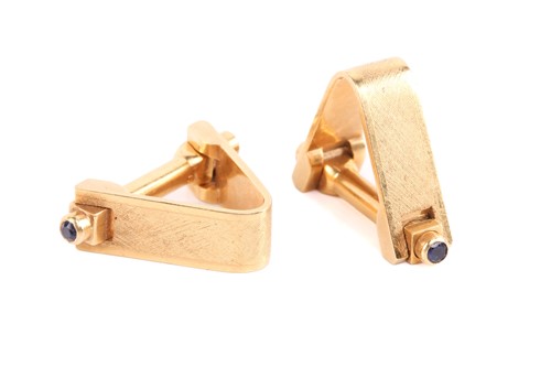 Lot 3 - A pair of stirrup cufflinks, embellished with...