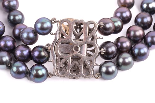 Lot 158 - A Tahitian pearl necklace with a diamond-set...