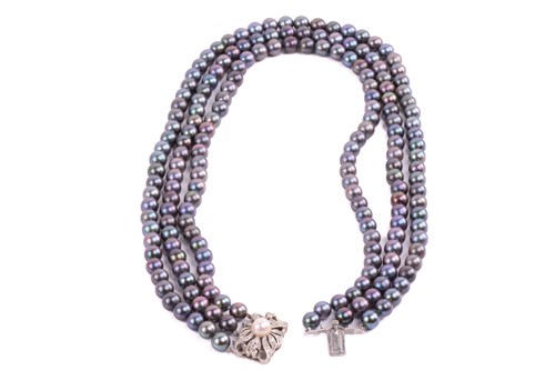 Lot 158 - A Tahitian pearl necklace with a diamond-set...