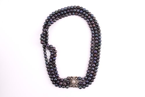 Lot 158 - A Tahitian pearl necklace with a diamond-set...