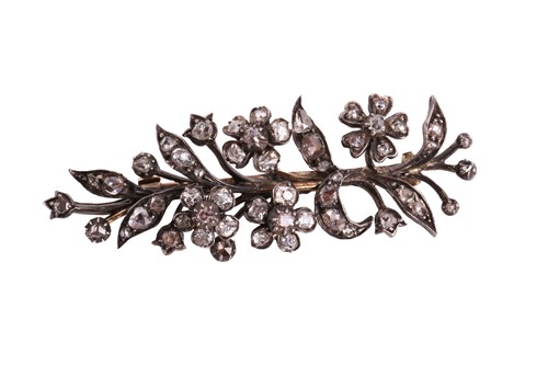 Lot 110 - A diamond brooch in form of a floral spray,...