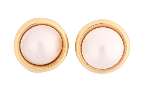 Lot 221 - A pair of mabé pearl clip-on earrings, each...