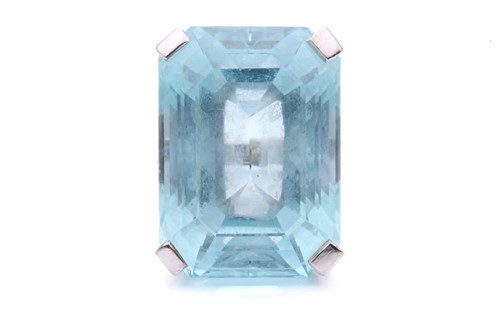 Lot 5 - A large aquamarine solitaire ring, claw-set...
