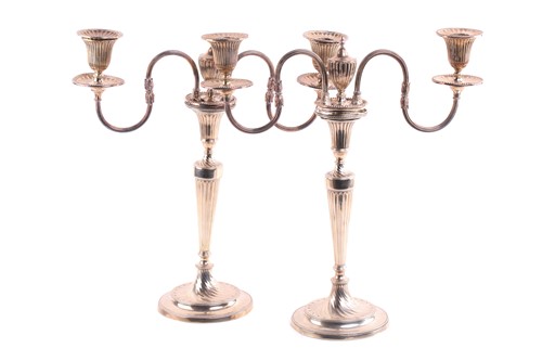 Lot 412 - A pair of George III silver candlesticks each...