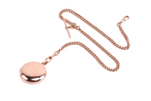 Lot 79 - A locket on a 9ct rose gold Albert chain, the...