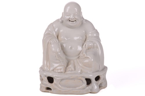 Lot 144 - A Chinese blanc de chine figure of Buddha,...