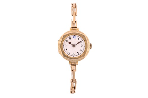 Lot 361 - A Ladies Edwardian 9ct gold watch, featuring a...