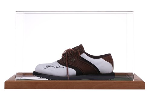 Lot 342 - Tiger Woods: a signed golf shoe, in a perspex...