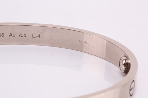 Lot 32 - Cartier - a 'LOVE' bangle in 18ct white gold,...