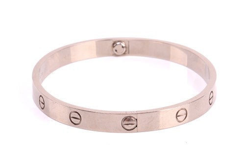 Lot 32 - Cartier - a 'LOVE' bangle in 18ct white gold,...