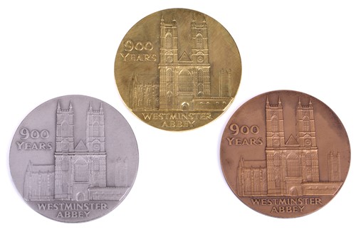Lot 339 - A Royal Mint commemorative three-medal set:...