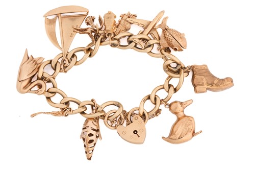 Lot 63 - A 9ct yellow gold charm bracelet with a...