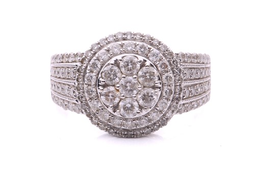 Lot 50 - A diamond-set cluster ring in 18ct white gold,...