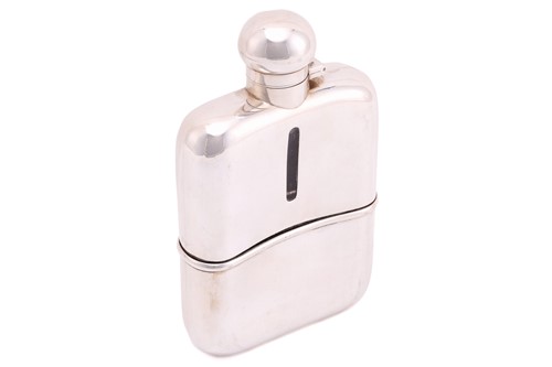 Lot 447 - An Edwardian silver hip flask; rounded...