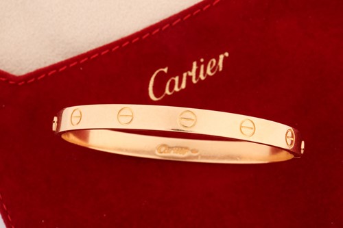 Lot 199 - Cartier - a 'LOVE' bangle, composed of two...