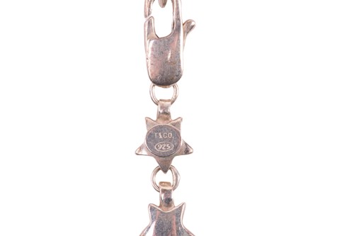 Lot 153 - Tiffany. A silver star link necklace, London...