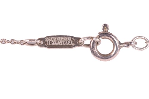 Lot 153 - Tiffany. A silver star link necklace, London...
