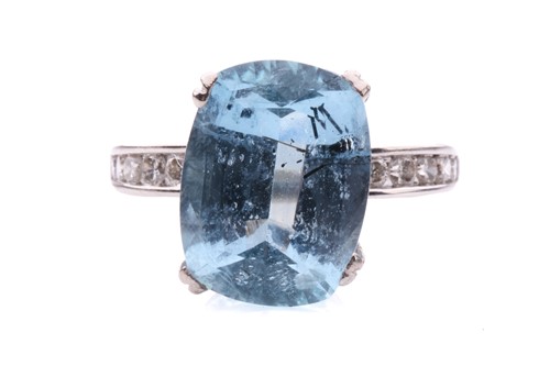 Lot 15 - An aquamarine solitaire ring, featuring a...