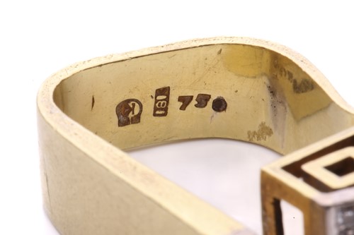 Lot 224 - A modernist diamond ring with a greek key...