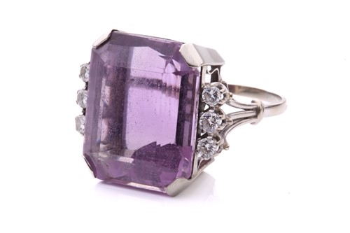 Lot 164 - An amethyst and diamond cocktail ring...