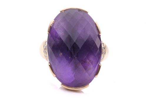Lot 92 - A large amethyst cocktail ring, set with an...