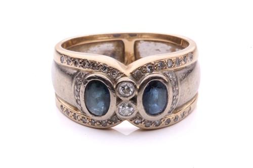 Lot 176 - A sapphire and diamond ring, the two sapphires...