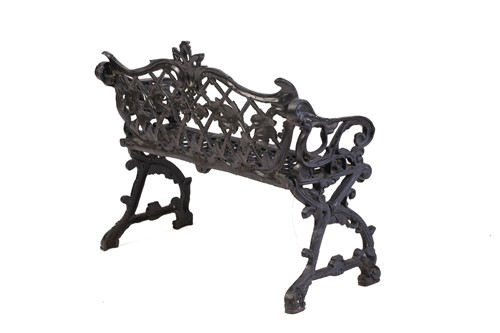 Lot 355 - A large heavy cast iron two-seat garden bench,...