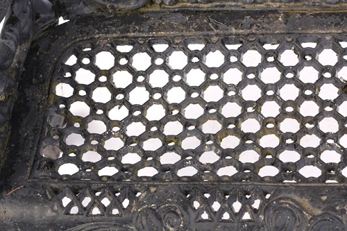 Lot 355 - A large heavy cast iron two-seat garden bench,...