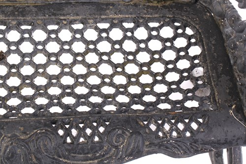 Lot 355 - A large heavy cast iron two-seat garden bench,...