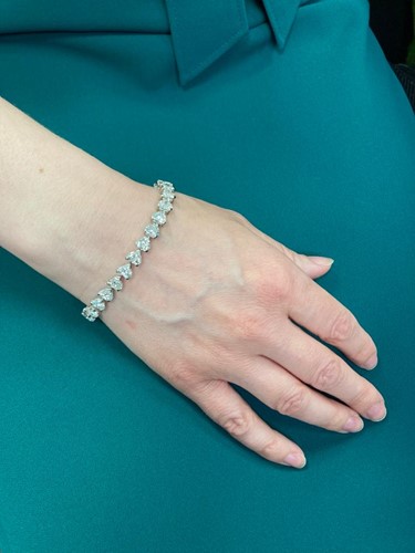 Lot 201 - A diamond tennis bracelet in platinum, set...