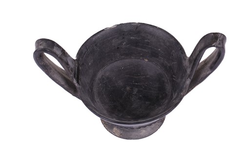 Lot 125 - A group of four Etruscan Bucchero-style black...