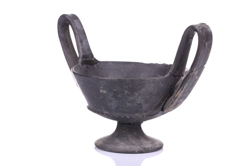Lot 125 - A group of four Etruscan Bucchero-style black...