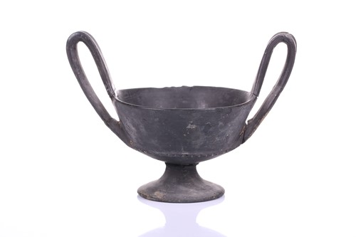 Lot 125 - A group of four Etruscan Bucchero-style black...