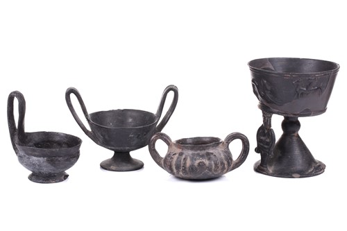 Lot 125 - A group of four Etruscan Bucchero-style black...