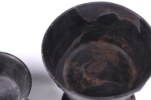 Lot 125 - A group of four Etruscan Bucchero-style black...