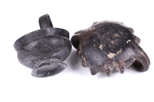 Lot 125 - A group of four Etruscan Bucchero-style black...