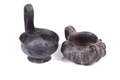 Lot 125 - A group of four Etruscan Bucchero-style black...