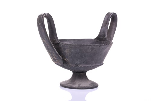 Lot 125 - A group of four Etruscan Bucchero-style black...