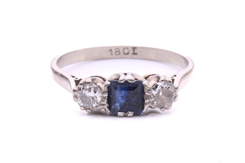 Lot 73 - A sapphire and diamond three-stone ring,...