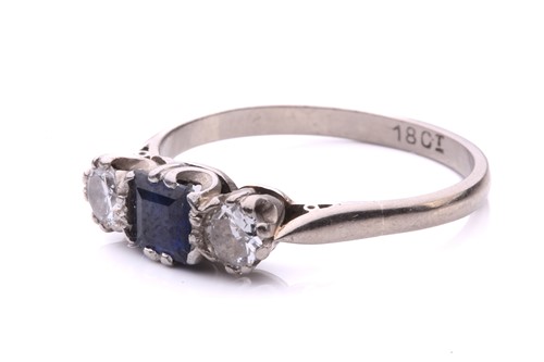 Lot 73 - A sapphire and diamond three-stone ring,...