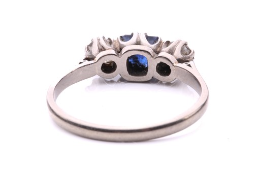 Lot 73 - A sapphire and diamond three-stone ring,...