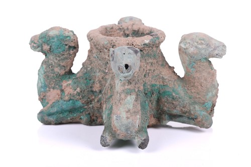 Lot 184 - A Persian bronze vessel in the form of camels,...