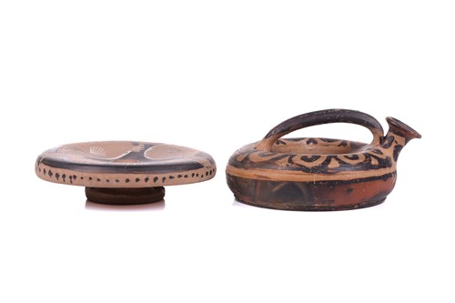 Lot 235 - An Apulian style red-figured fish plate,...