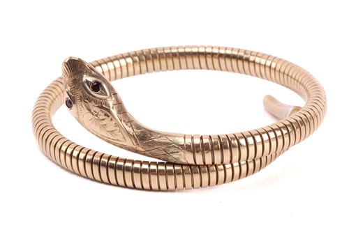 Lot 139 - A gold snake bracelet, the engraved head set...