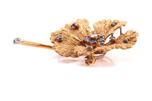 Lot 1 - A sapphire and diamond flower brooch,...