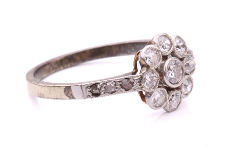 Lot 231 - A diamond floral cluster ring, set with a...