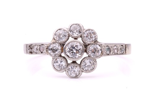 Lot 231 - A diamond floral cluster ring, set with a...